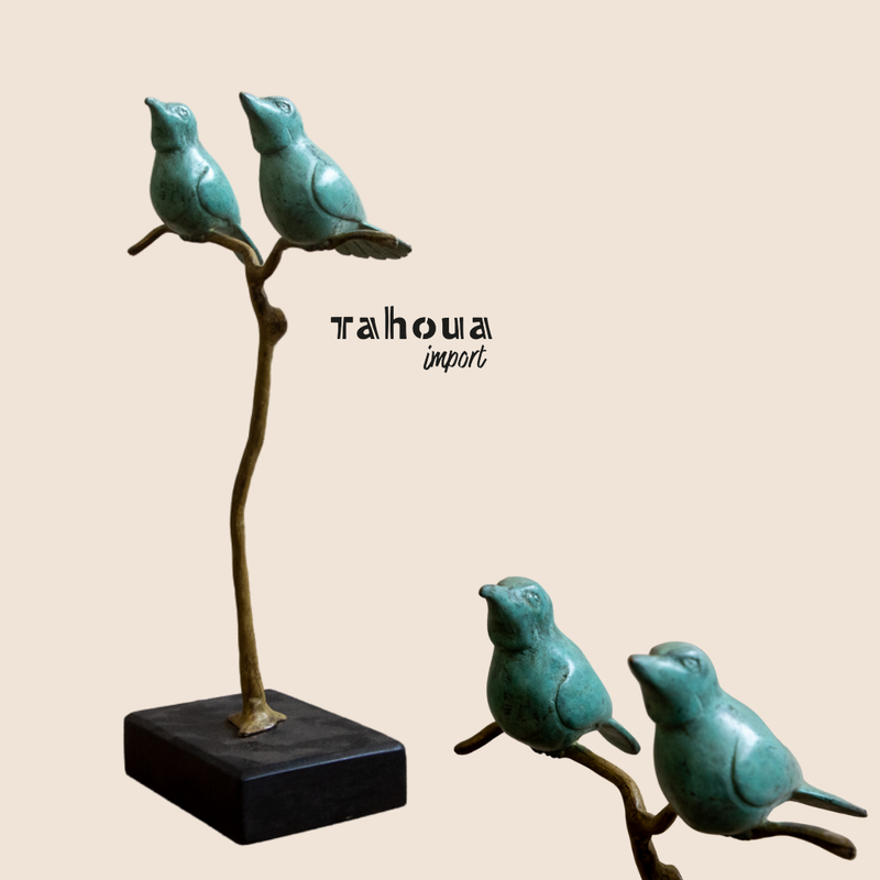 Twee vogeltjes in Turquoise op een tak