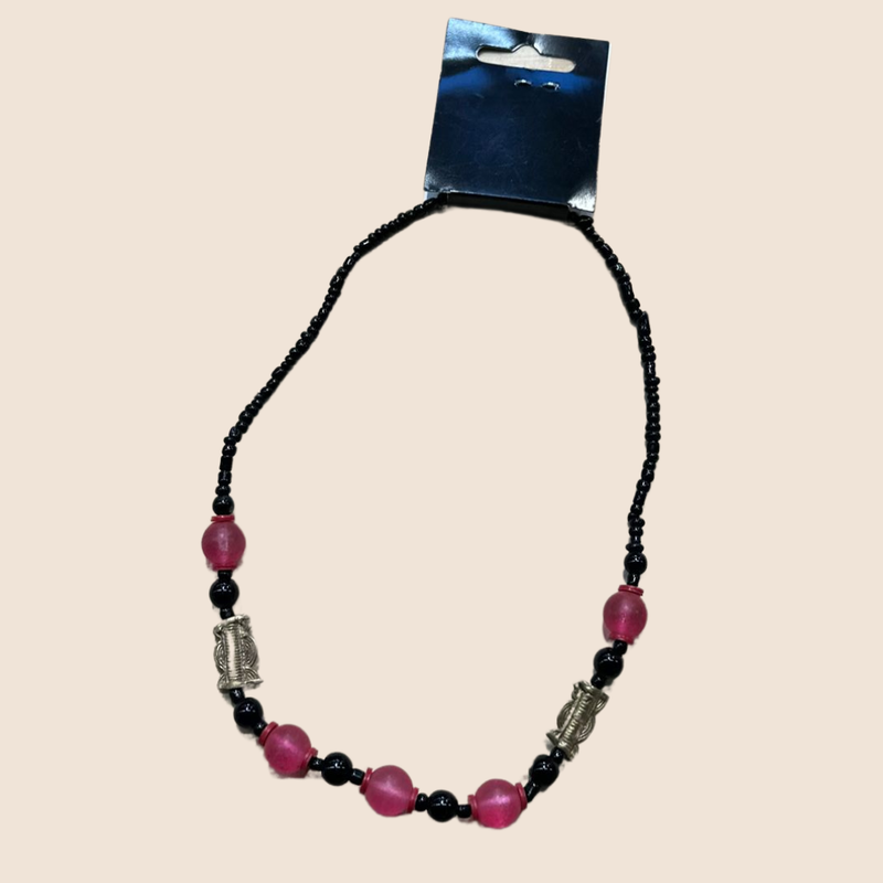 Necklace with pink beads and bronze details